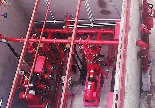 Red fire protection pipework in a plant room