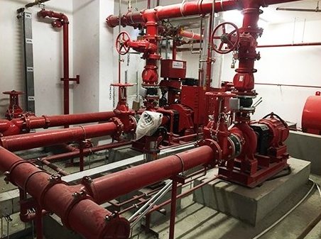 Fire pump room with red pipework